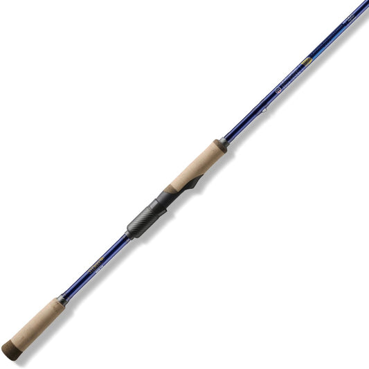 The St. Croix Legend Tournament Bass Spinning Rod 7'10" Medium Swimming Baits by St. Croix, featuring cork handles, SCIV+ Carbon Fiber construction, and a black reel seat, is shown diagonally on a white background.