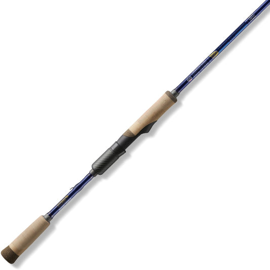 The St. Croix Legend Tournament Bass Spinning Rod 7'3" Medium Power Finesse (LBTS73MXF) features a blue finish, light cork handles, and a black reel seat—designed for finesse techniques—shown on a white background.