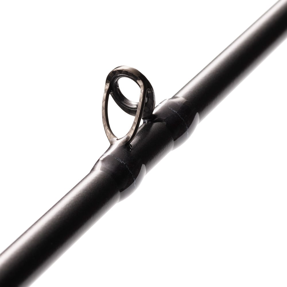 Close-up of a St. Croix Legend Xtreme 6’8” Medium Fast Casting Rod (XFC68MF) in black, highlighting a single metal line guide against a white background.