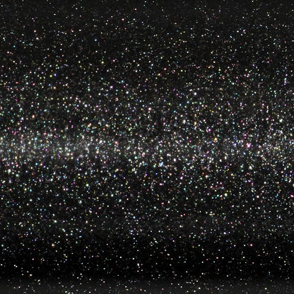 A close-up view of a glittery, black surface covered with countless tiny, colorful sparkles, resembling the shimmering finish on the St. Croix Legend Xtreme 7’1” Medium Heavy Casting Rod by St. Croix.