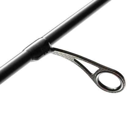 Close-up of a black fishing rod guide on the St. Croix Legend Xtreme 6’10” Medium Light Spinning Rod (XFS610MLXF), highlighting the circular eyelet and its attachment against a white background.