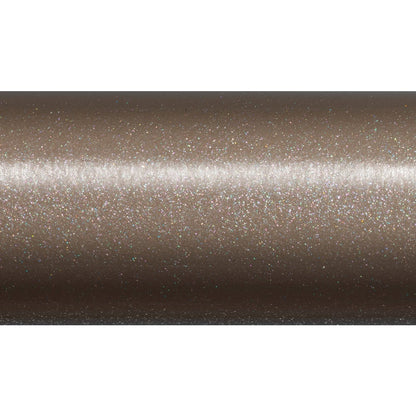 A close-up of a metallic, light brown surface with shimmer and fine glittery specks, echoing the glossy finish of the St. Croix Legend Xtreme Inshore Spinning Rod 7'0" Medium Heavy (XSS70MHF) by St. Croix’s high-modulus SCVI carbon blank.