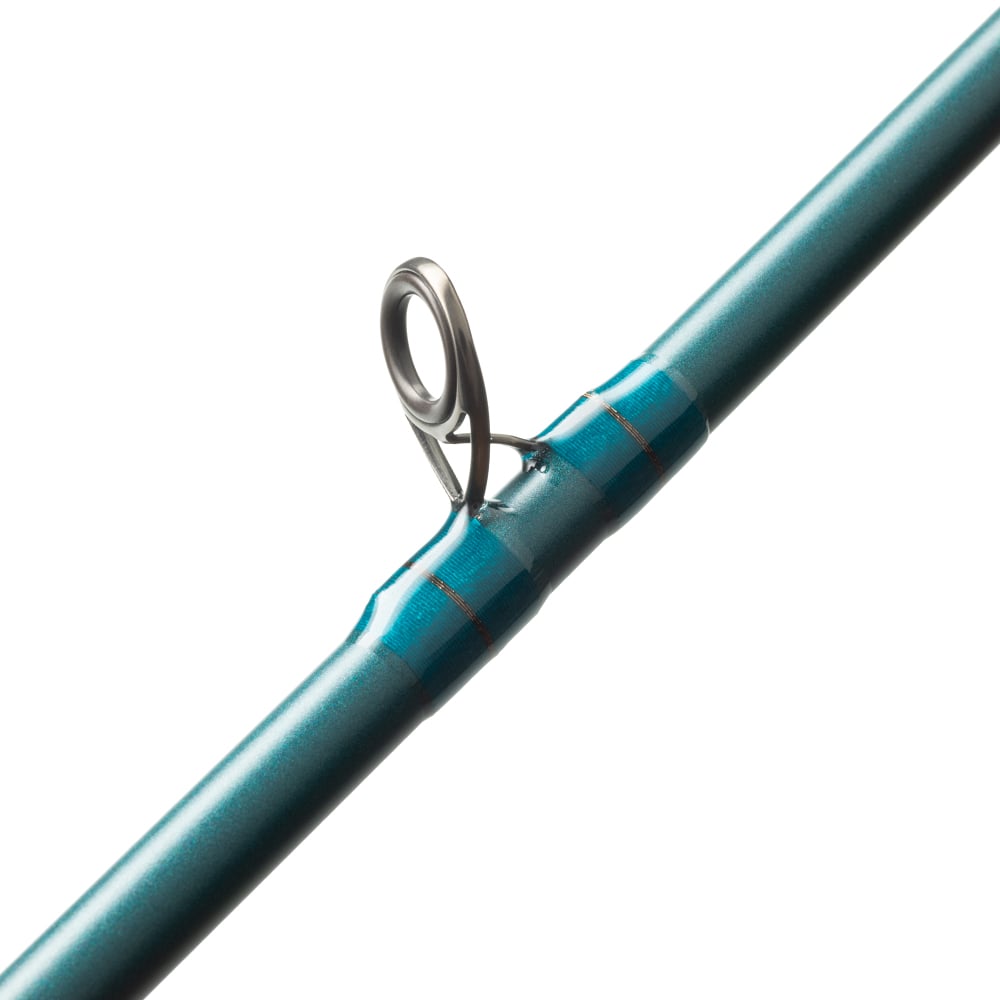 Close-up of the St. Croix Mojo Inshore Casting Rod 7'11" Heavy (JIC711HMF) by St. Croix, highlighting a precisely wrapped metal guide ring—ideal for anglers seeking premium inshore saltwater performance.