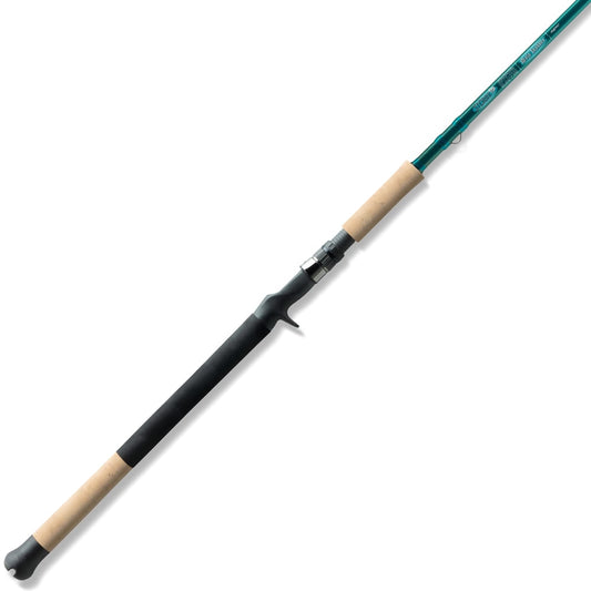 The St. Croix Mojo Inshore Casting Rod 7'0" Medium Heavy (JIC70MHF) by St. Croix is shown with a green shaft, light wood and black handle, and trigger grip reel seat on a white background.