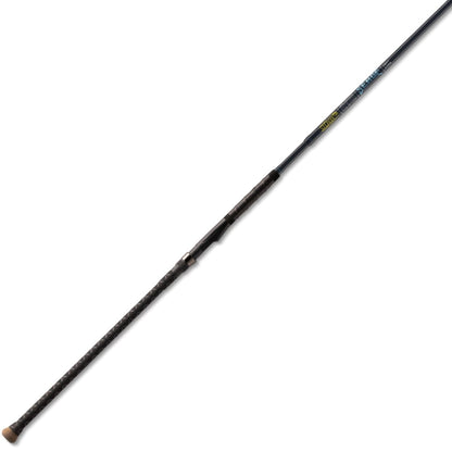 The St. Croix Seage Surf Series Spinning Rods 12'0" Heavy 2pc (SES120HMF2) features a dark, slender design with a textured grip handle, shown against a white background.