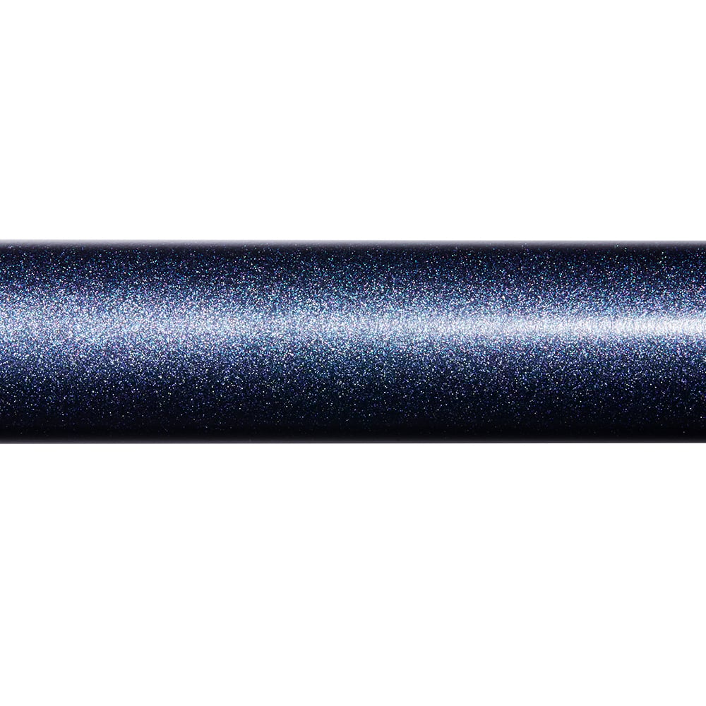 A close-up of a cylinder-shaped object with a dark, metallic, and sparkly surface reflecting light, similar to the shimmering finish found on the St. Croix Seage Surf Series Spinning Rods 7’0” Medium 1pc (SES70MMF) by St. Croix.