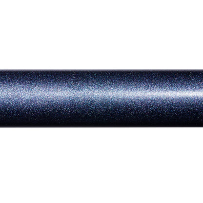 A close-up of a cylinder-shaped object with a dark, metallic, and sparkly surface reflecting light, similar to the shimmering finish found on the St. Croix Seage Surf Series Spinning Rods 7’0” Medium 1pc (SES70MMF) by St. Croix.