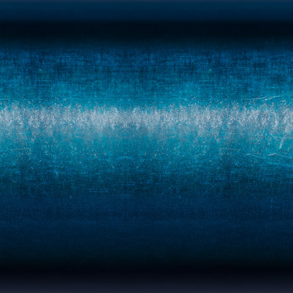 Abstract image with a deep blue horizontal gradient and a bright, misty white band at the center—evoking the reflection seen while fishing with the St. Croix Triumph Travel Spinning Rod 6'6” Medium Light (TSR66MLF4) by St. Croix.