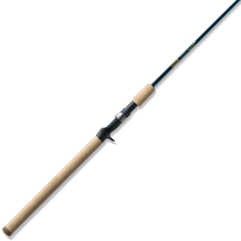 The St. Croix Triumph Casting Rod 6'6” Medium Heavy (TCR66MHF) features a long cork handle, black reel seat, and a slender blue SCII carbon rod, shown on a white background.