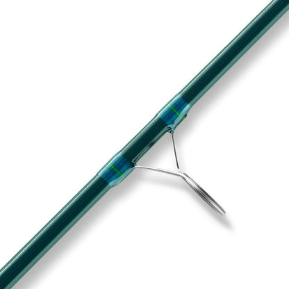 Close-up of the St. Croix Triumph Inshore Spinning Rod 7'0” Heavy (TRIS70HF) with a metal guide ring, secured by blue and green thread wrap, on a white background—ideal for serious inshore anglers.