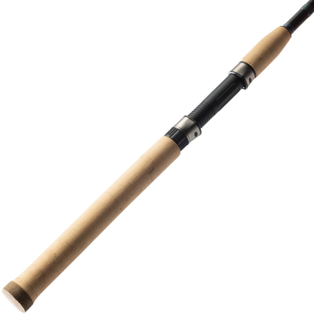 A close-up of the St. Croix Triumph Inshore Spinning Rod 7'0” Medium Light (TRIS70MLF) handle reveals a cork grip and black reel seat, expertly crafted from premium SCII carbon, angled against a white background.