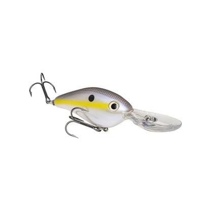 The Strike King 8XD Crankbait features a silver and yellow body, black spot by the eye, two treble hooks, and a clear plastic lip for deep diving—ideal for bass fishing—displayed against a white background.