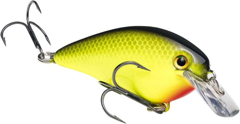 The Strike King KVD Squarebill Crankbait by Strike King is designed for bass fishing, featuring a yellow-green body, black back, red mouth accent, two treble hooks, and a clear plastic bill ideal for shallow water.
