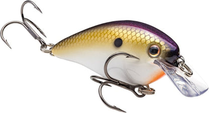 A close-up of the Strike King KVD Squarebill Crankbait by Strike King, shaped like a small fish with a shiny yellow and purple scale pattern, two treble hooks, and a clear plastic lip for shallow water fishing.