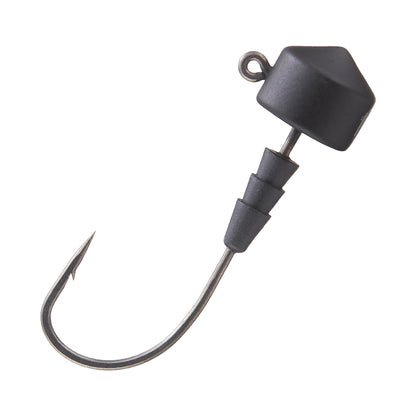 Close-up of the VMC Redline Series Tungsten Ned Head, featuring a black needle point hook with a sharp, curved tip and hexagonal tungsten head. The shank has three ridges for securing bait.