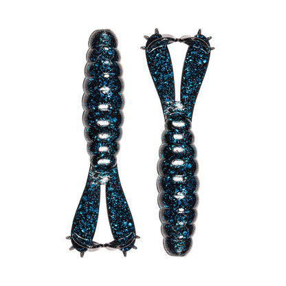 Two Z-Man Goat Twin Tail Grubs feature durable ElaZtech construction, with segmented shiny dark blue bodies and twin tails with small protrusions, displayed side by side on a white background.