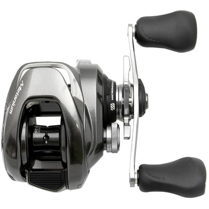 A close-up of the Shimano Metanium MGL 150XGB casting reel featuring two black handles, a sleek design with "Metanium" branding on its side, and a durable Magnesium CoreSolid Body from americanlegacyfishing, perfect for enhancing your angling experience.