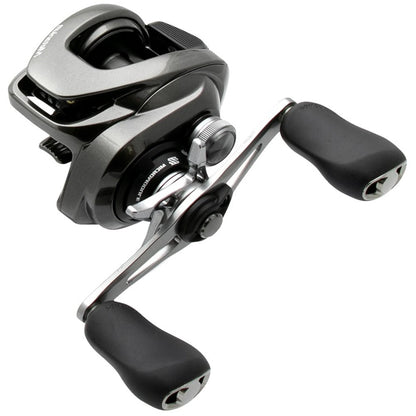 A close-up of the Shimano Metanium MGL 151XGB 8.1:1 Left Hand Casting Reel, showcasing its compact Magnesium CoreSolid Body, dual ergonomic handles, and sleek black and silver accents.