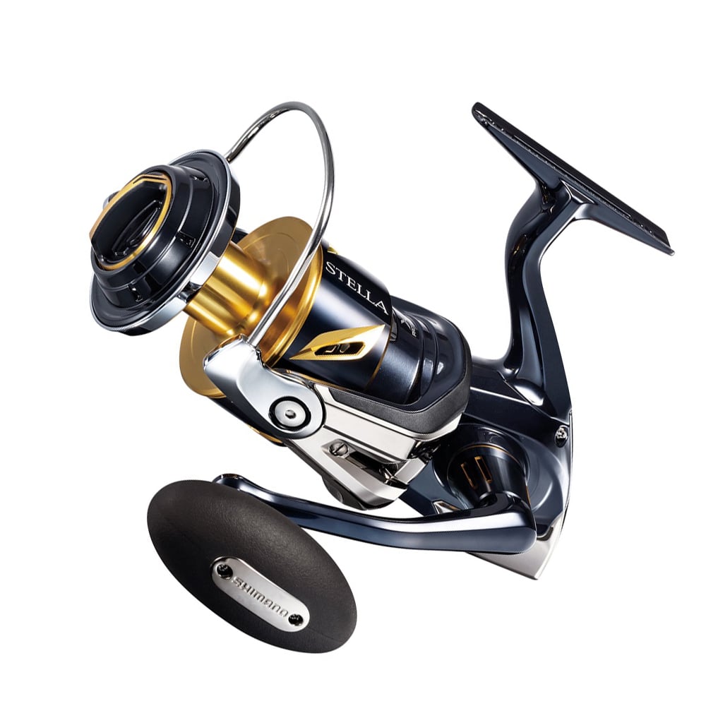 Meet the Shimano Stella SW C 14000XGC Spinning Reel | STLSW14000XGC, blending sleek curves and precision engineering with a glossy black finish and gold accents. This reel is perfect for saltwater anglers, featuring a prominent handle and subtly showcasing the renowned Shimano brand.