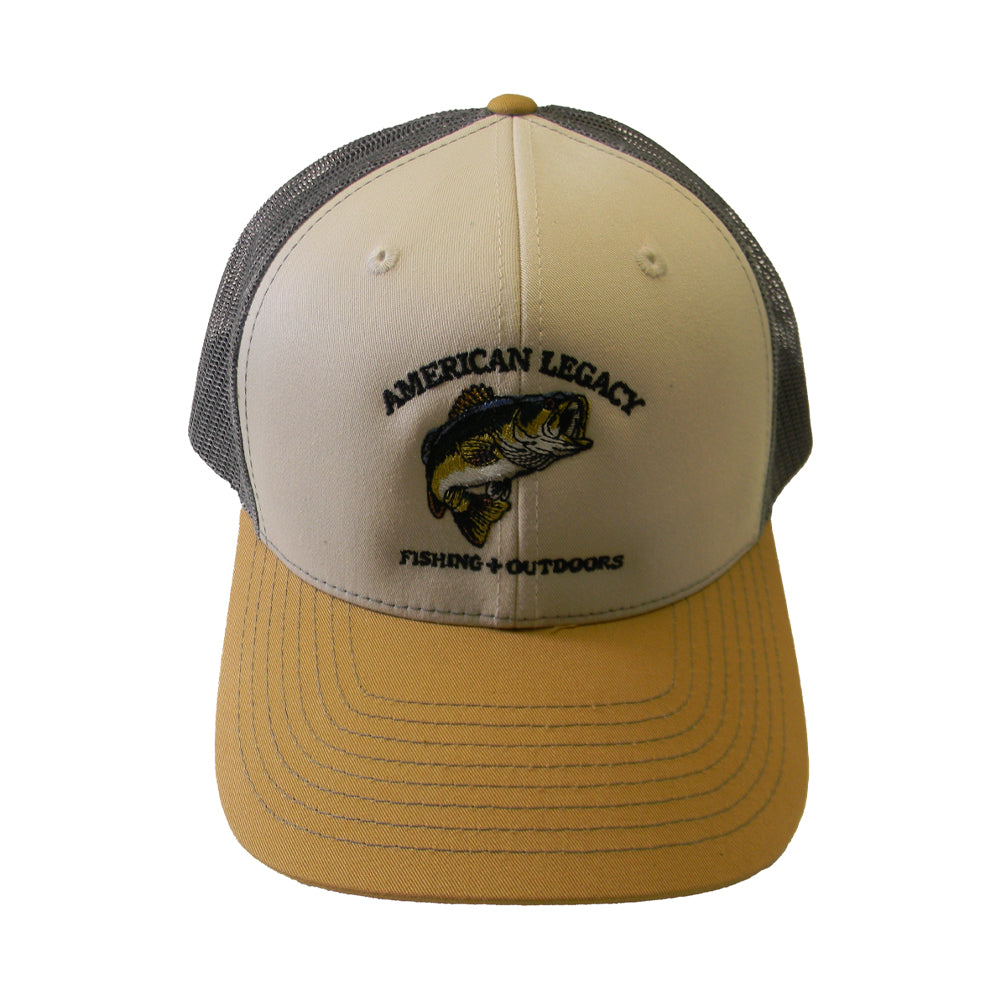 A beige/brown trucker cap from American Legacy Fishing & Outdoors featuring an embroidered bass design and the text "American Legacy Fishing + Outdoors" on the front, with a mesh back.