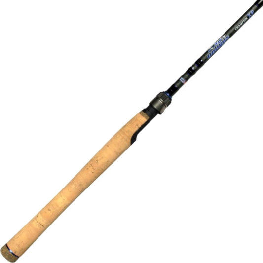 A close-up of the Dobyns Champion XP 7'0" Heavy Spinning Rod with a light tan cork handle, black finish, and white/blue writing. It features Fuji Guides and a metal reel seat near the handle, set against a plain white background.