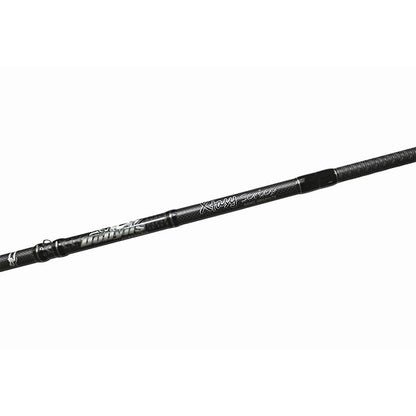 Close-up of a Dobyns Xtasy 7'2" Heavy Casting Rod | DRX 724C in black with "Xtra Heavy Series" text, featuring Fuji Torzite guides and a textured grip. Reinforced segments highlight its renowned durability against a plain white background.