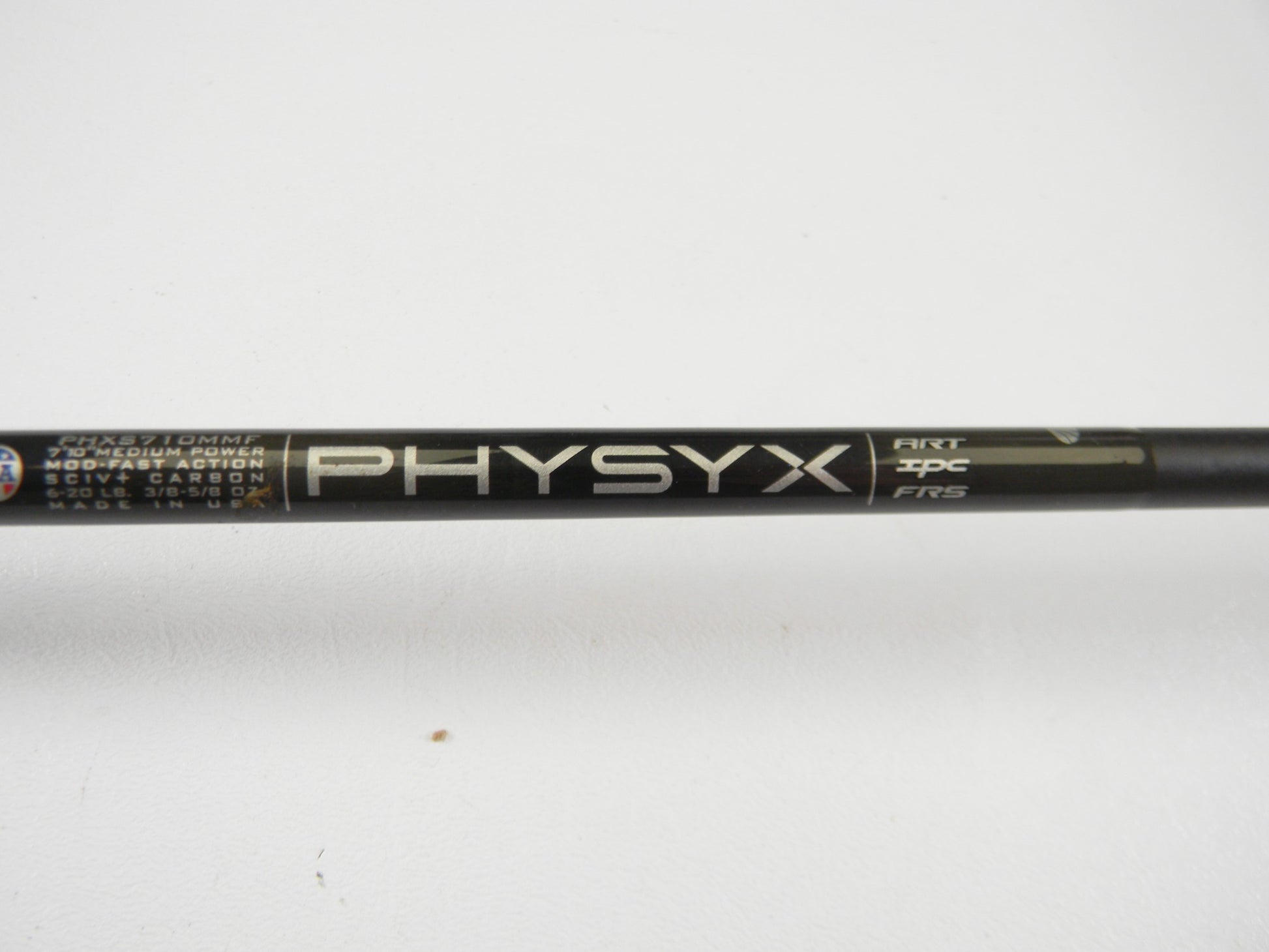 Close-up of a St. Croix Physyx PHXS710MMF 7'10" Medium Used Spinning Rod in very good condition with specs like "ART," "IMPC," and "FRS" on the shaft, plus "Made in USA." Perfect for quality used gear seekers or trade-ins. Plain white background.