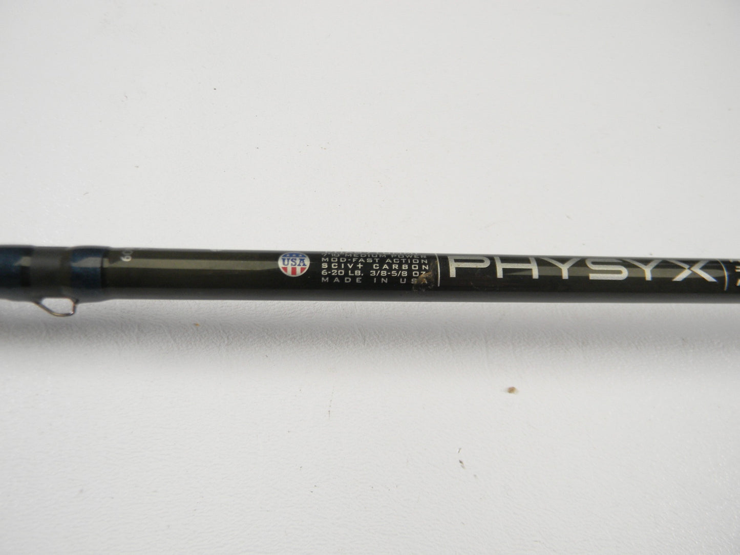 Close-up of a used St. Croix Physyx PHXS710MMF 7'10" medium spinning rod in very good condition on a plain white background. Great for those interested in used gear or wanting store credit through our rod and reel trade-in.