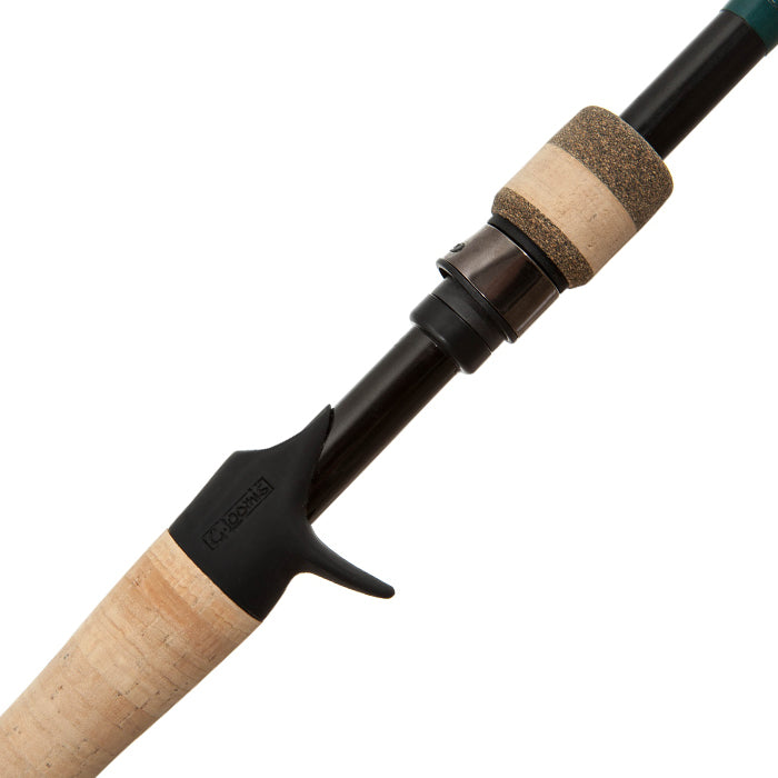 Close-up of the G. Loomis Conquest CNQ 783C MBR Mag Bass Casting Rod handle, showing Spiral-X Technology, cork grip, reel seat, and black trigger grip on a white background.