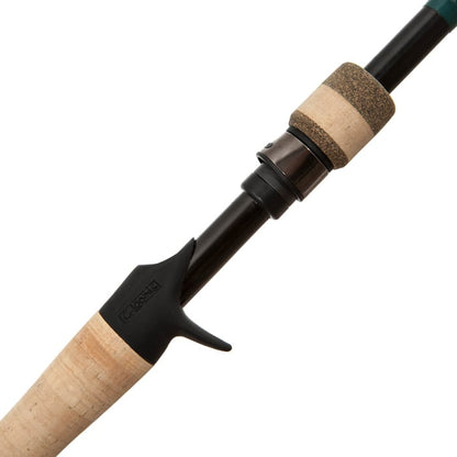 Close-up of the G. Loomis Conquest CNQ 842C MBR Mag Bass Casting Rod handle, featuring a cork grip, black reel seat with trigger design for baitcasting reels, and built with Spiral-X Technology for enhanced strength.