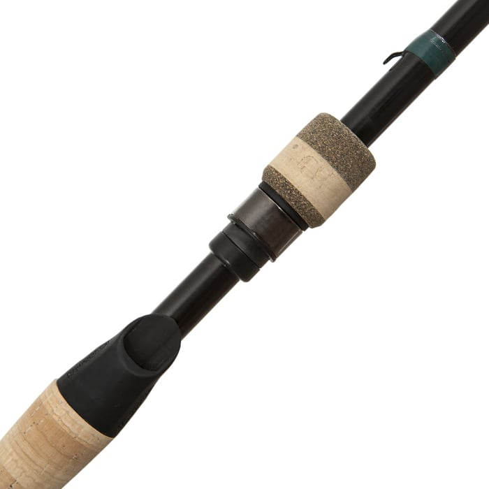 Close-up of the G. Loomis Conquest CNQ 844C MBR Mag Bass Casting Rod handle, showing its black finish, cork and foam grips, reel seat, and advanced Spiral-X Technology.