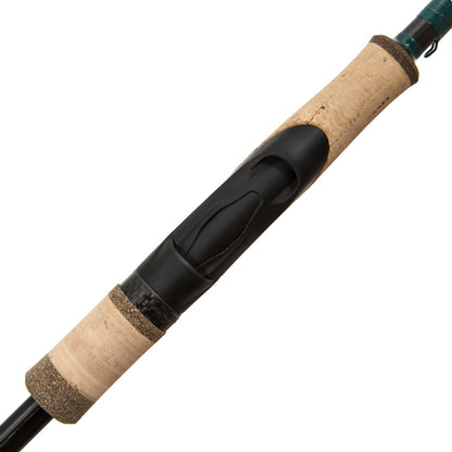 Close-up of the G. Loomis Conquest CNQ 842S SJR Spin Jig Spinning Rod handle, showing its cork grip and black plastic reel seat with textured and smooth areas crafted using Spiral-X Technology.
