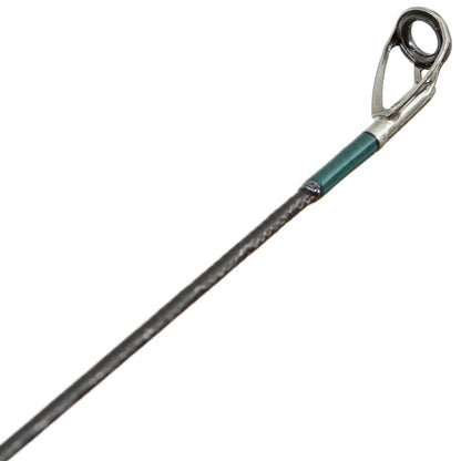 Close-up of the top guide eyelet on the G. Loomis Conquest CNQ 843S SJR Spin Jig Spinning Rod, showing its metal ring and support at the tip and highlighting advanced Spiral-X Technology.