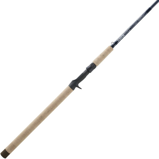 The G. Loomis Salmon Mooching Fishing Rod SAMR1265C features a long cork handle, black reel seat, and slim dark rod, designed specifically for casting or salmon mooching.