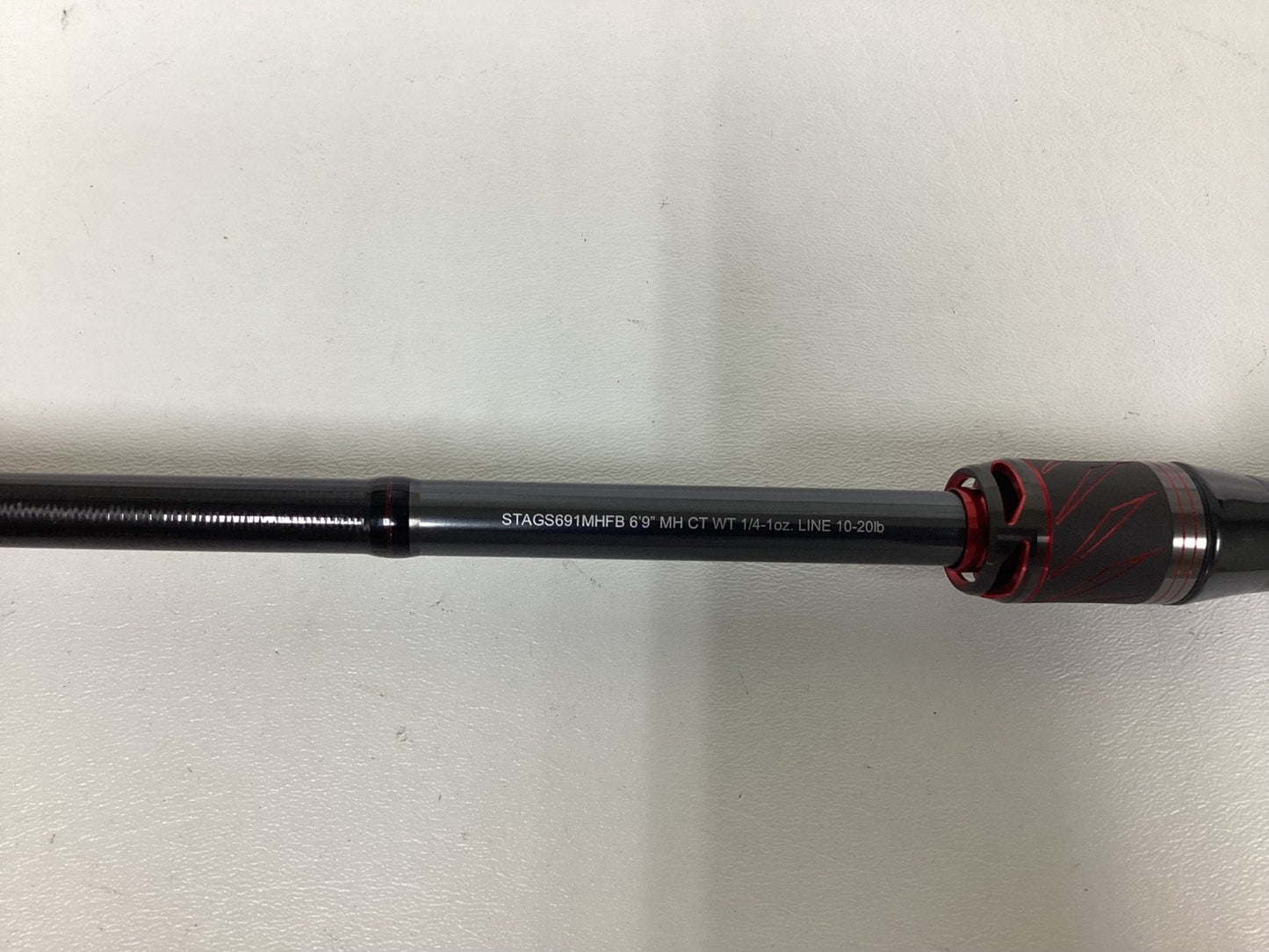 A close-up of a Daiwa Steez AGS STAGS691MHFB used casting rod in excellent condition, with black text showing specs, ideal for trading in during our Rod and Reel Trade-In event to earn store credit, against a white background.