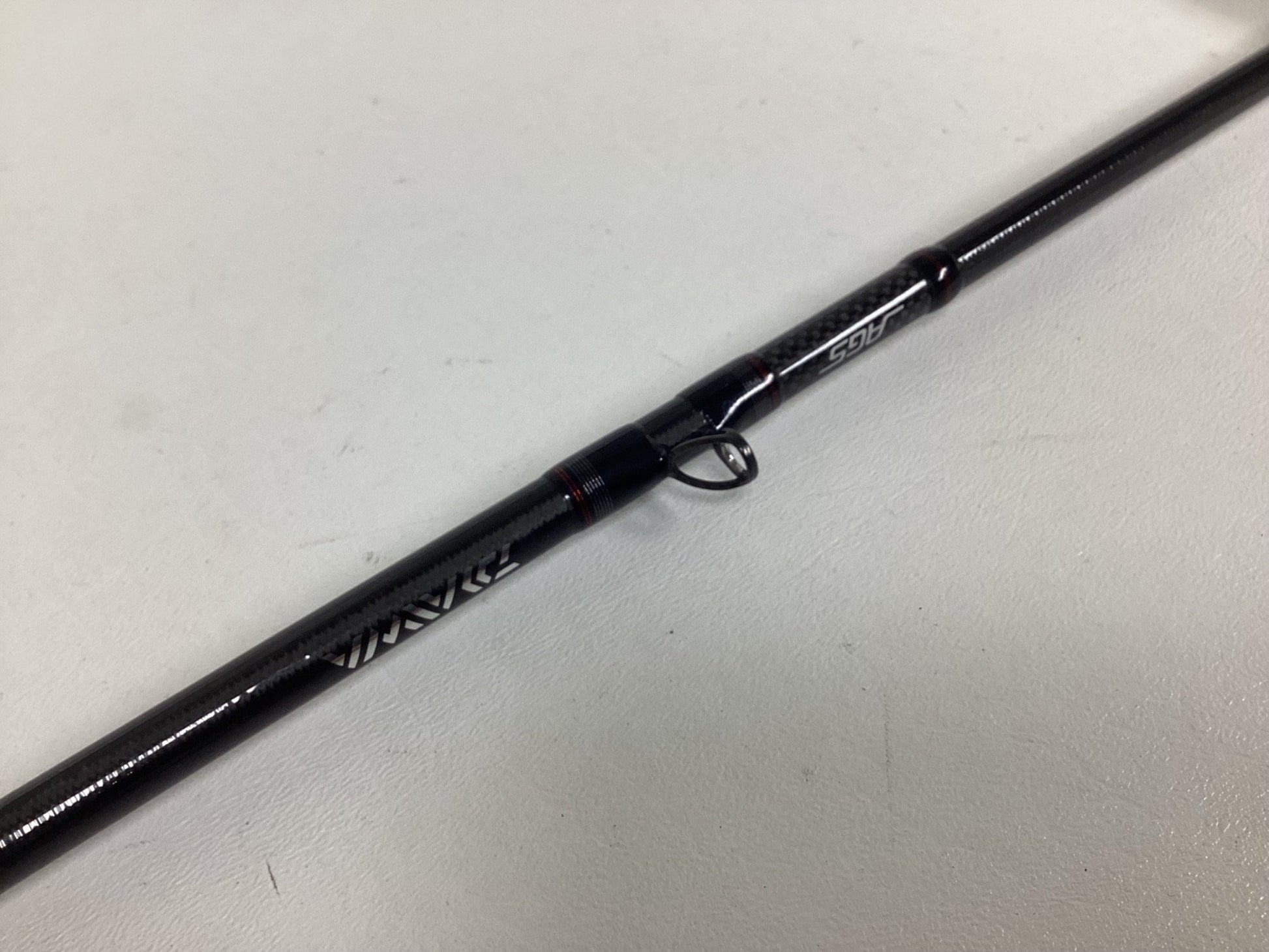 A close-up of a Daiwa Steez AGS STAGS691MHFB Used Casting Rod in excellent condition, highlighting the line guide ring and brand—ideal for those interested in used Daiwa gear or the Rod and Reel Trade-In for store credit.
