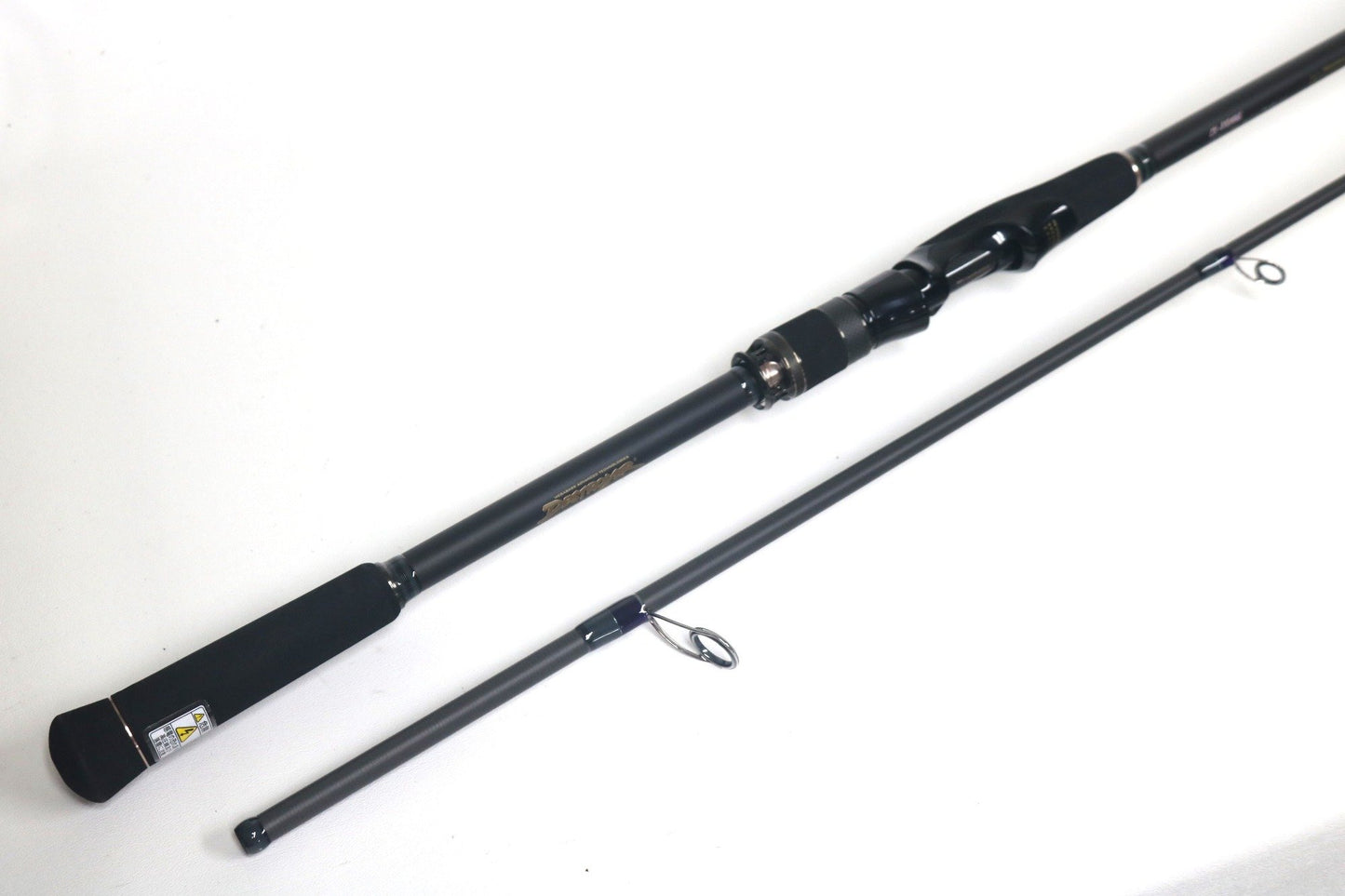 The Megabass Cookai Inshore Spinning Rod - CK810MHS (Used, Excellent) features a black handle and silver reel seat. Upgrade with our Rod and Reel Trade-In Program to earn store credit for your used gear.