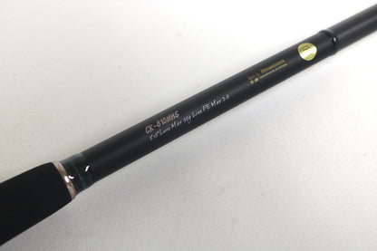 A close-up of a Megabass Cookai Inshore Spinning Rod - CK810MHS, black with gold and white text, used in excellent condition—ideal for our Rod and Reel Trade-In Program if you want store credit or quality used gear.