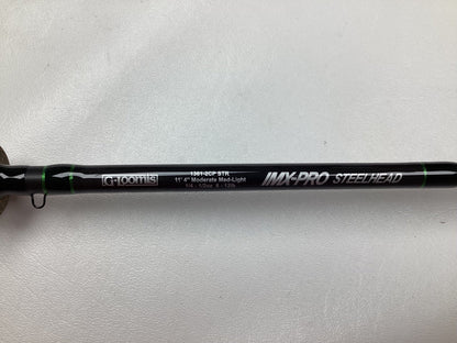 A close-up of a black G. Loomis IMX-PRO Steelhead Centerpin Rod labeled 1361-2CP STR, showing specs: 11'4" Medium Light, Used - Mint Condition.