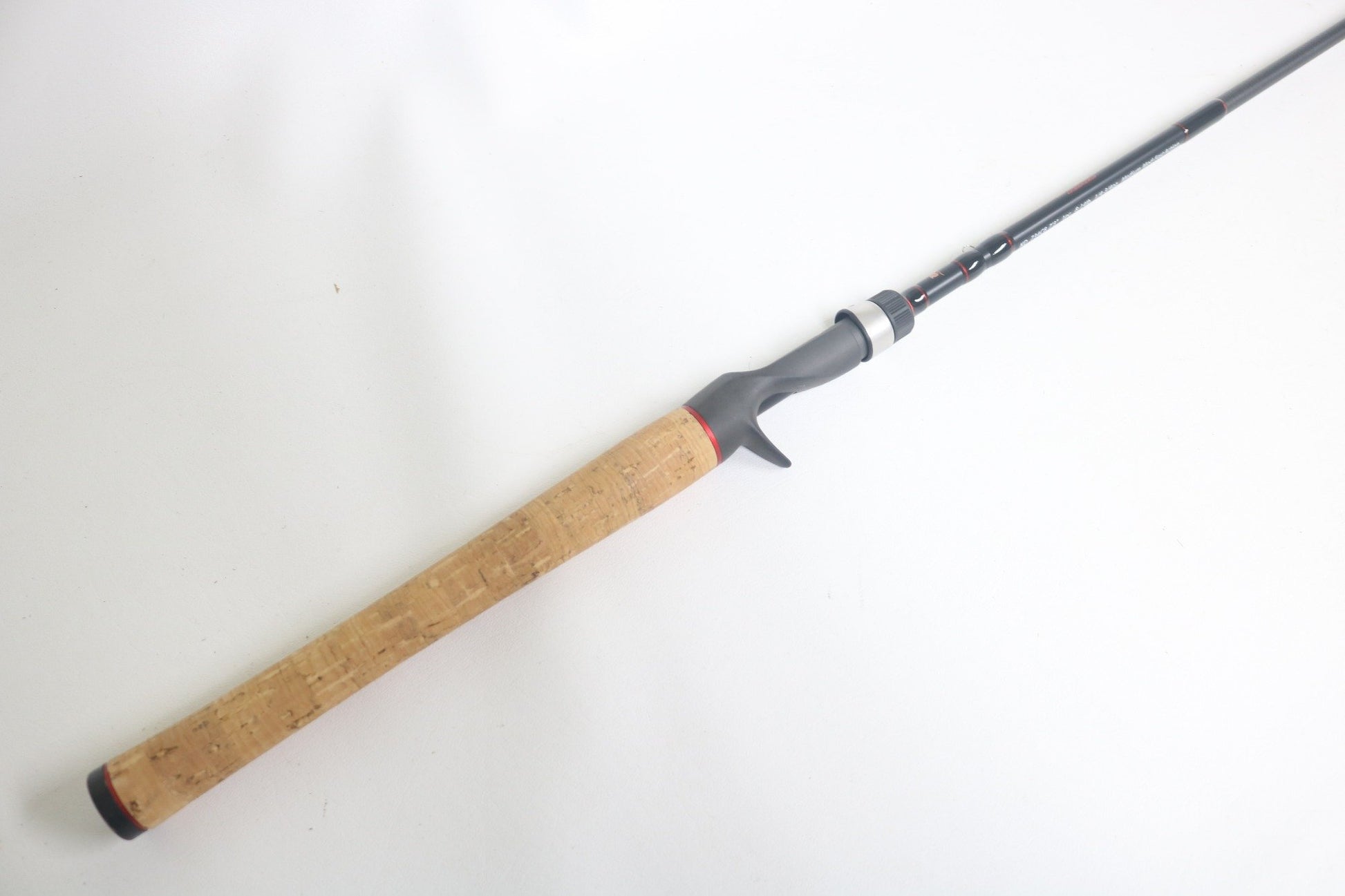 A Dobyns Kaden KD734CB 7'3" Medium Mod-Fast Used Casting Rod in excellent condition, featuring a cork handle and black reel seat, is shown on a plain white background.