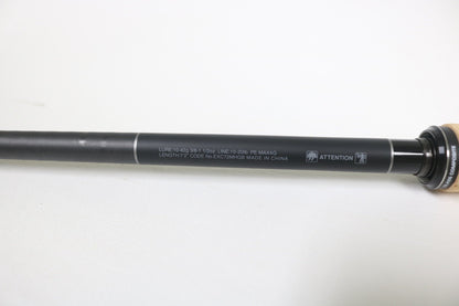 A close-up of the Shimano Expride B EXC72MHGB 7'2" Medium Heavy Glass casting rod shows specs on the shaft, ideal for those trading in used Shimano gear for store credit. This rod is in excellent condition and ready for your next adventure.