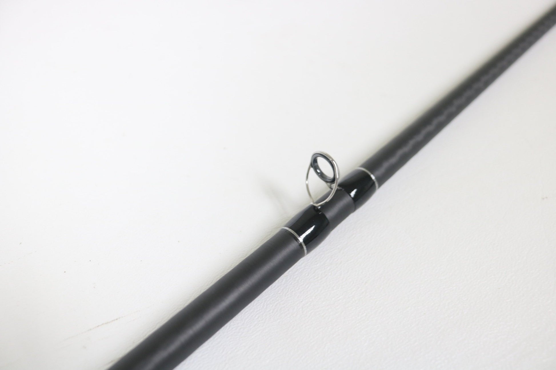 A close-up of a Shimano Expride B EXC72MHGB 7'2" Medium Heavy Glass Used Casting Rod in excellent condition, perfect for showcasing Shimano’s quality or browsing our rod and reel trade-in program.