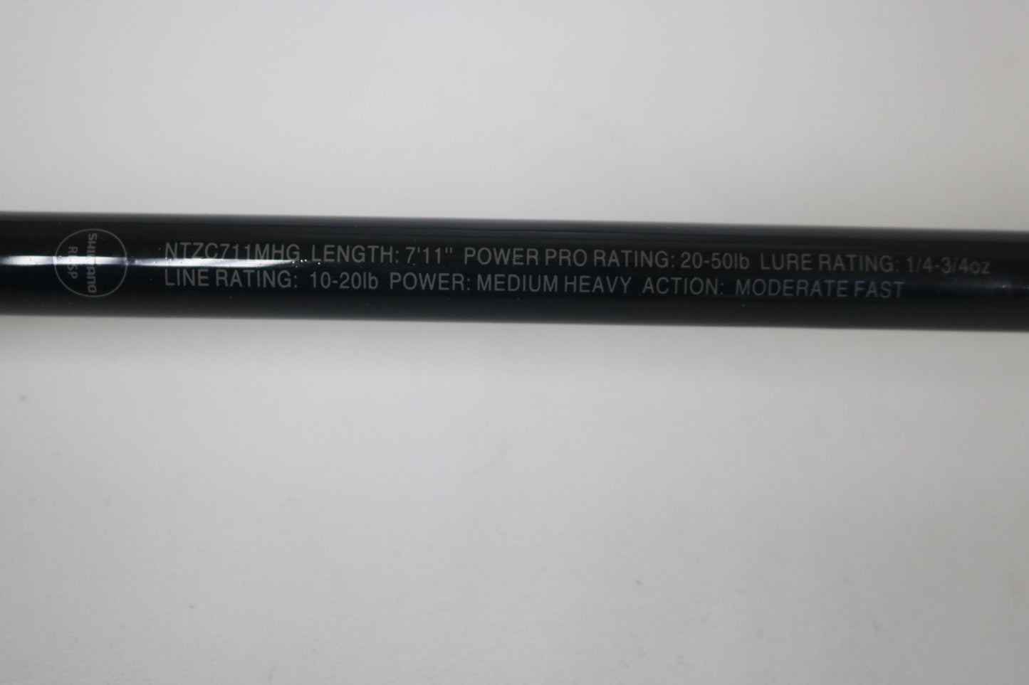 Close-up of a Shimano Intenza NTZC711MHG 7'11" Medium Heavy Glass Used Casting Rod in excellent condition—trade in your used gear through our Rod and Reel Trade-In Program and earn store credit!.