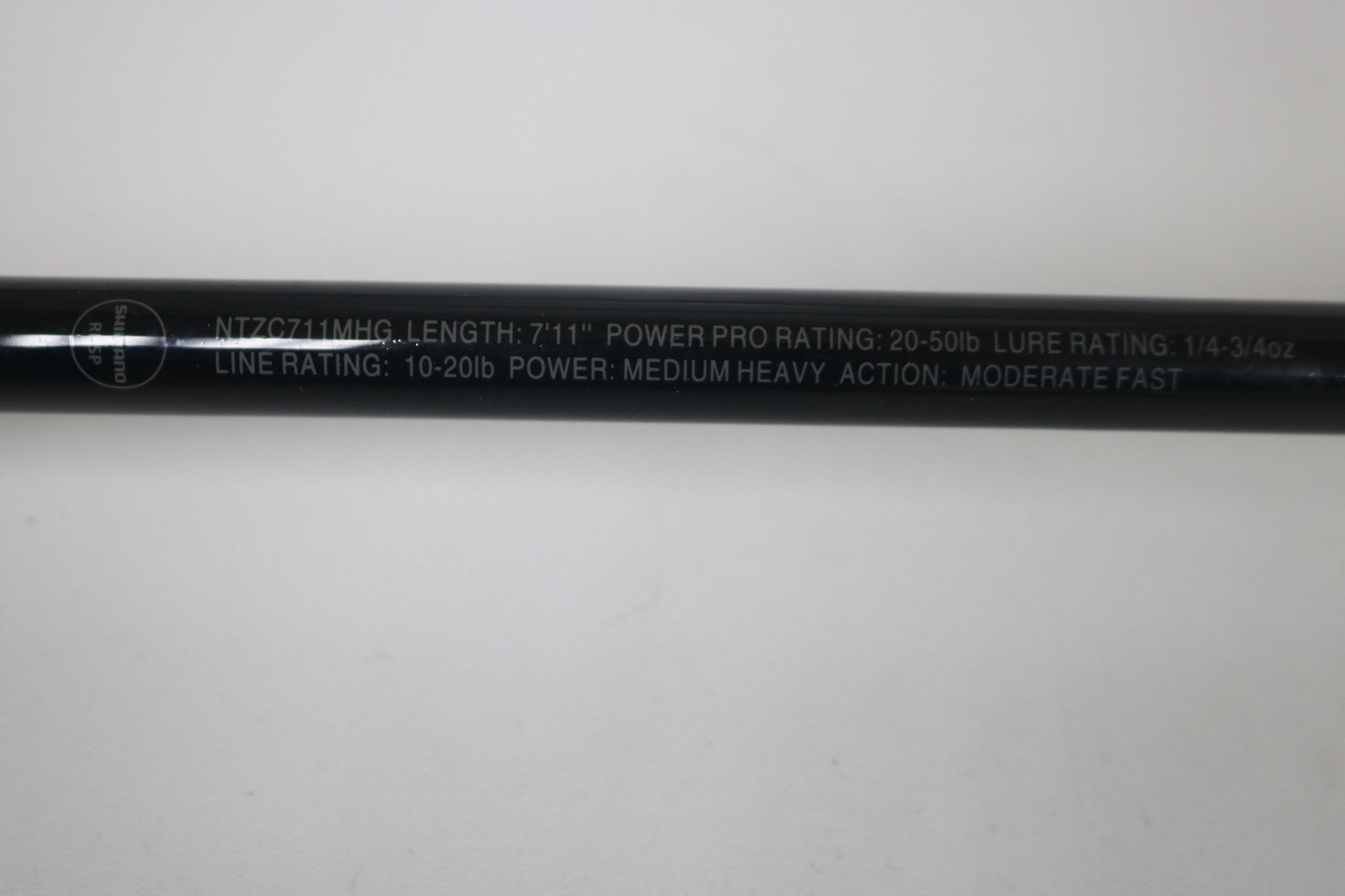 Close-up of a Shimano Intenza NTZC711MHG 7'11" Medium Heavy Glass Used Casting Rod in excellent condition—trade in your used gear through our Rod and Reel Trade-In Program and earn store credit!.