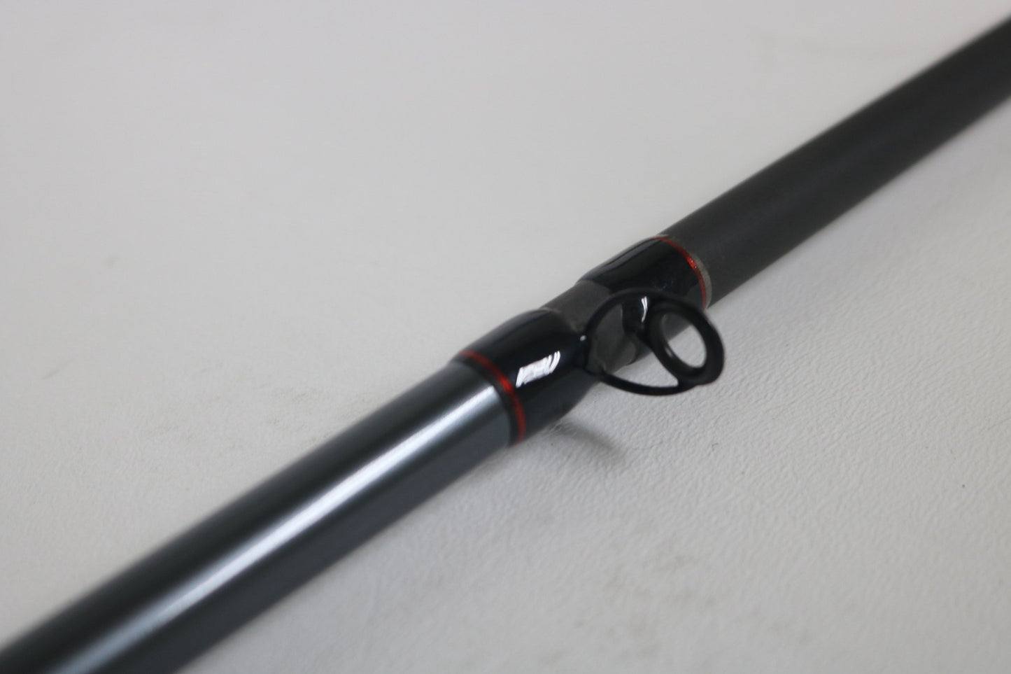 Close-up of a Shimano Intenza NTZC711MHG 7'11" Medium Heavy Glass Used Casting Rod in excellent condition—ideal for trading up through our Rod and Reel Trade-In Program for store credit or quality used gear.