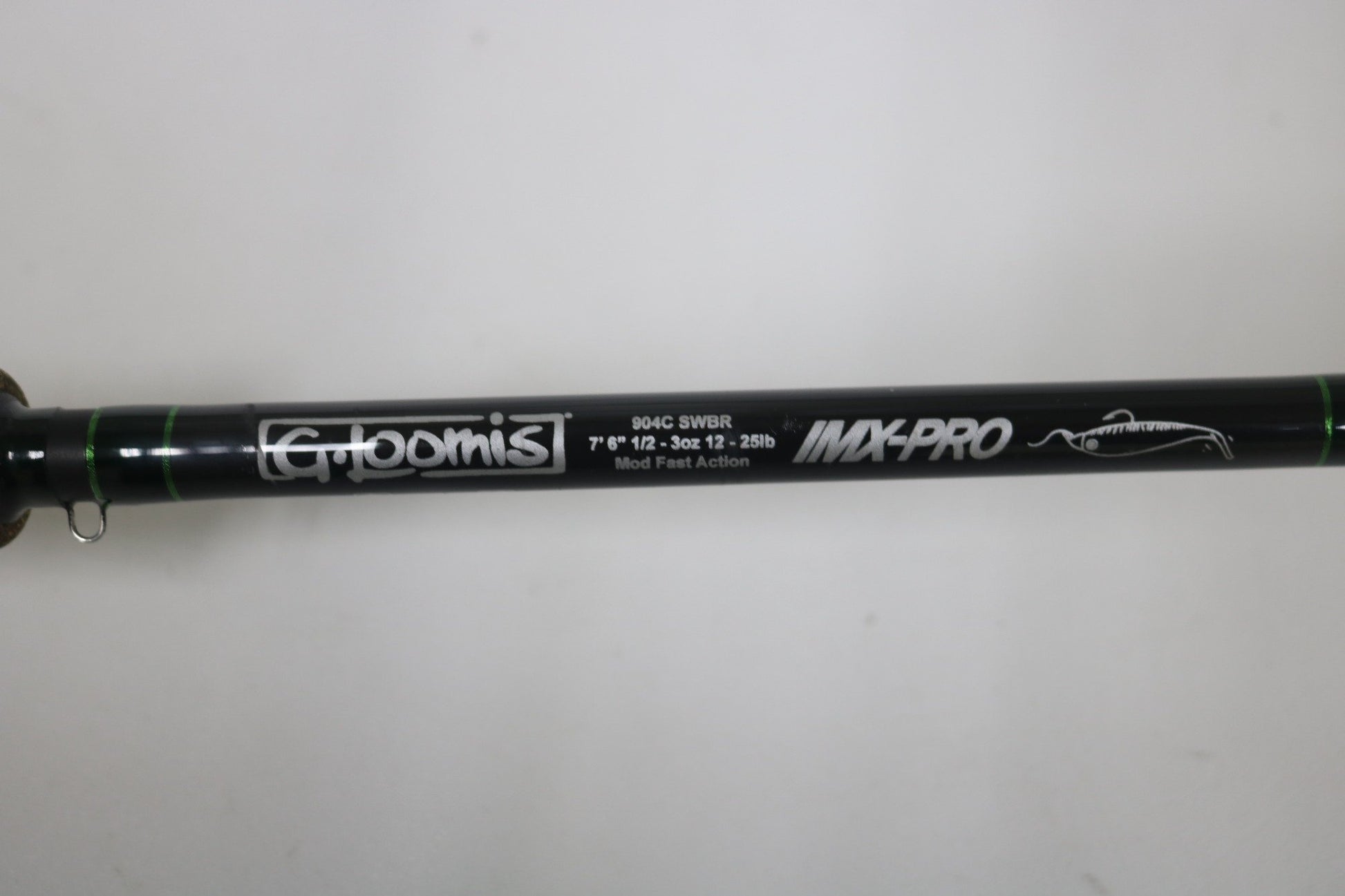 Close-up of the G. Loomis IMX-PRO 904C SWBR 7'6" Used Casting Rod—excellent condition, 1/2–3 oz, 12–25 lb, Mod Fast Action. Ask about our rod and reel trade-in program for used gear or store credit!.