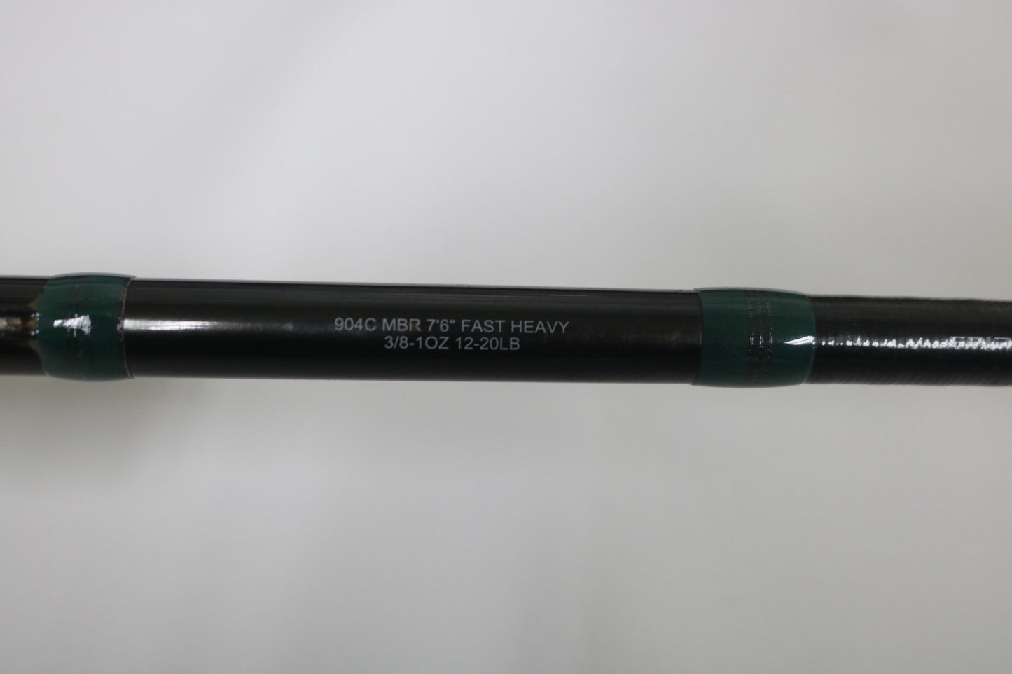 A close-up of the G. Loomis Conquest CNQ 904C MBR 7'6" Heavy Used Casting Rod in very good condition—ideal for upgrading with our Rod and Reel Trade-In Program.