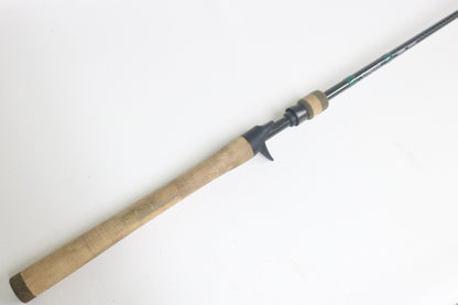 A close-up of the G. Loomis Conquest CNQ 903C MBR 7'6" Medium Heavy used casting rod in good condition—ideal for anglers looking to trade in gear for store credit through our program.
