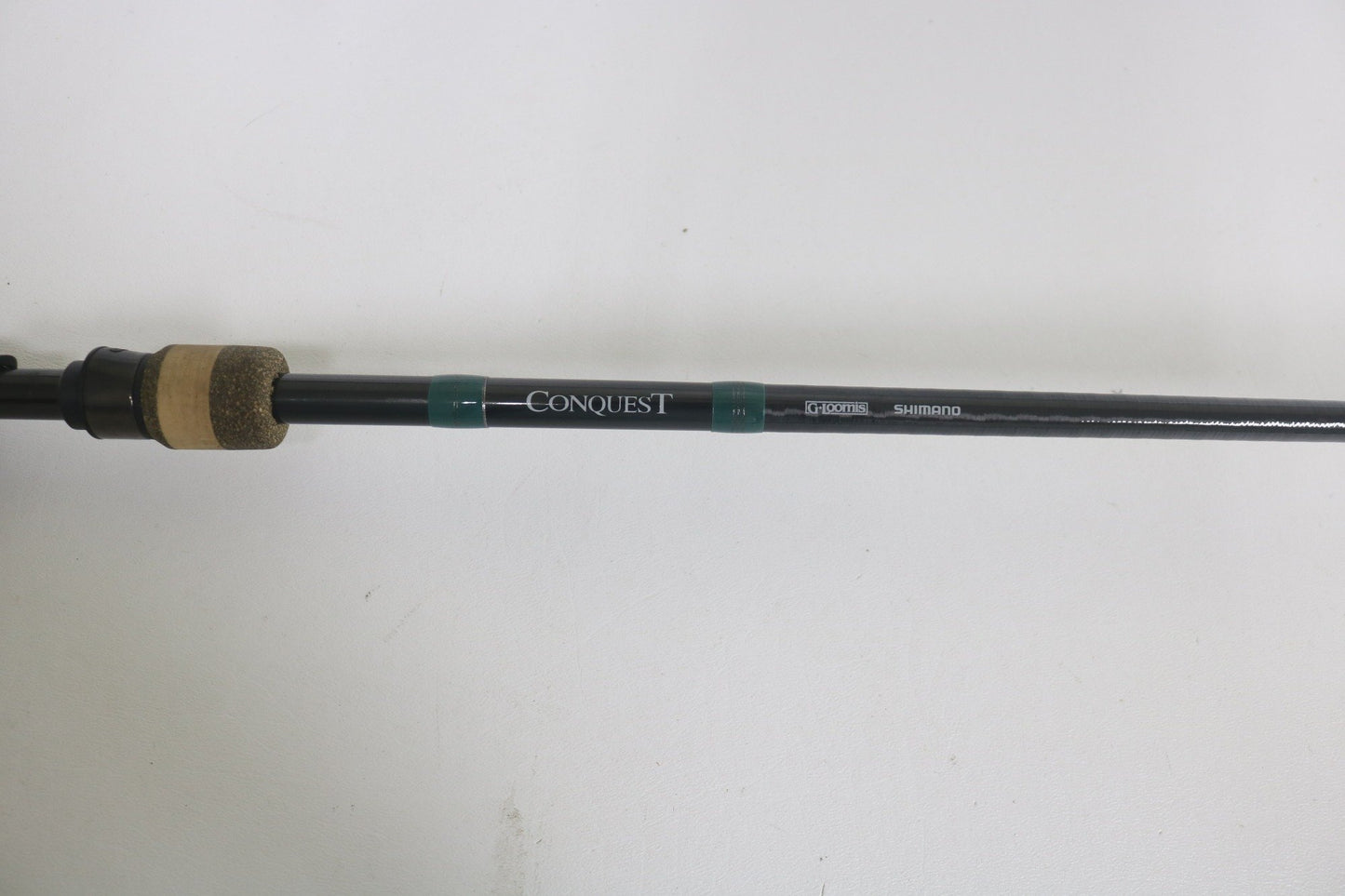Close-up of a G. Loomis Conquest CNQ 903C MBR 7'6" Medium Heavy Used Casting Rod in good condition—ideal for those interested in our rod and reel trade-in program or wanting to upgrade used gear for store credit. Brand: G. Loomis.