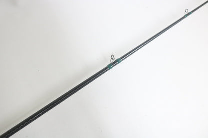 A close-up of the G. Loomis Conquest CNQ 903C MBR 7'6" Medium Heavy Used Casting Rod in good condition, shown diagonally on a white background—perfect for upgrading your gear with our trade-in program for store credit.